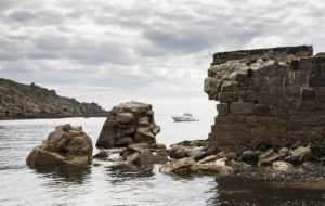 Cecienne through wreckage of Lamorna Quay, West Cornwall